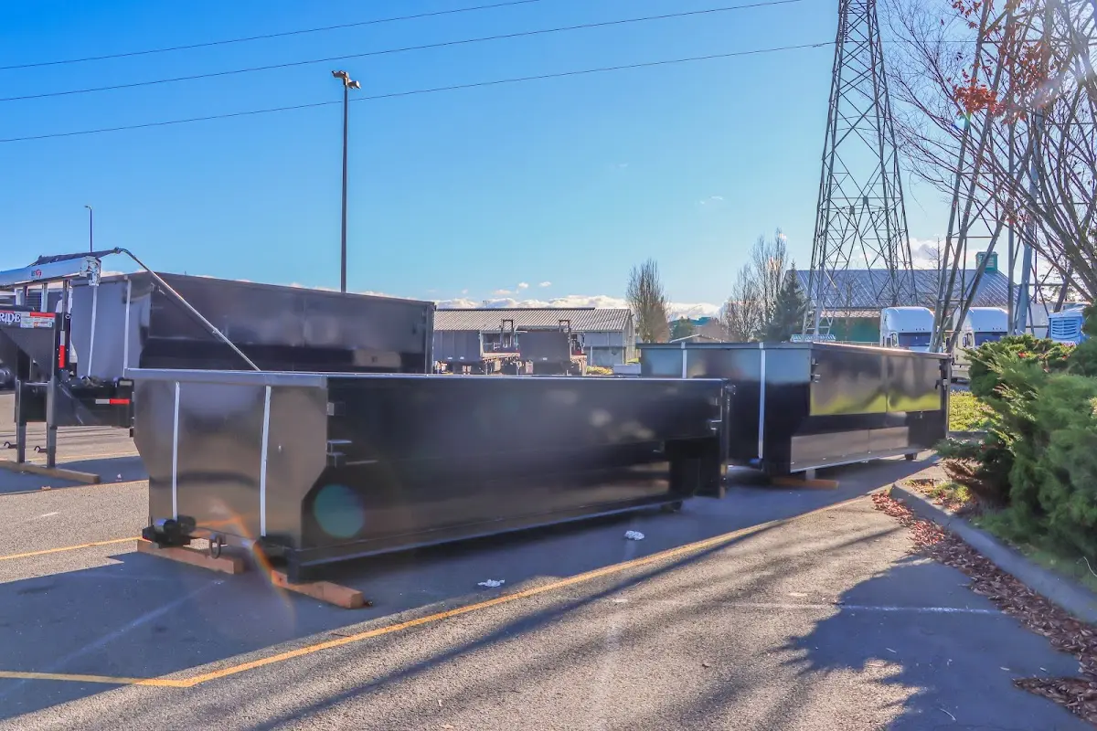 Roll-off dumpster ready for waste disposal at job site for Demolition Dumpster Rental in Bear